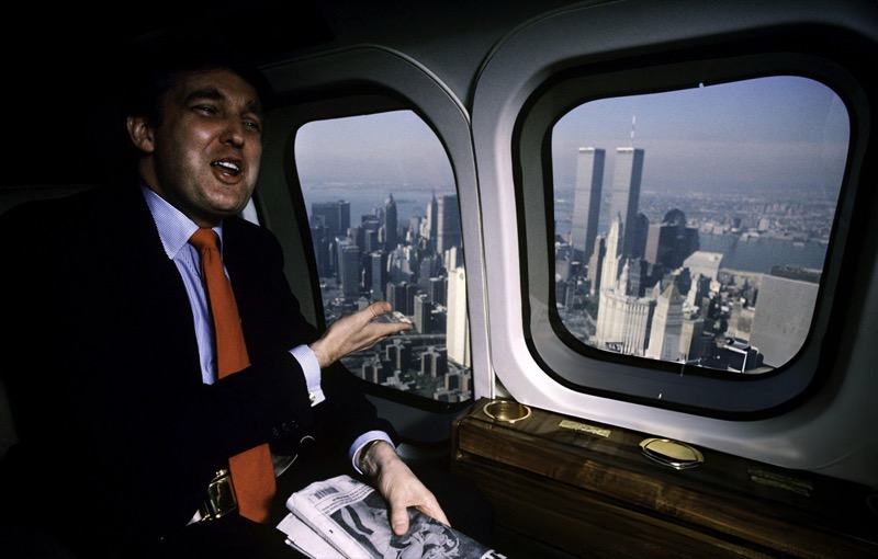 Donald J. Trump inside jet looking at Manhattan skyline
